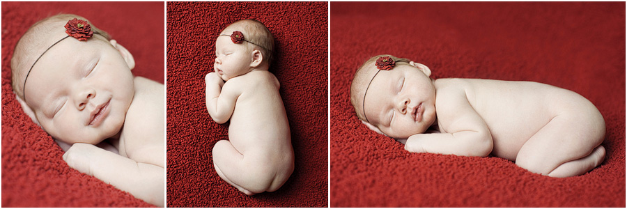 newborn baby on red blanket sugar land newborn photographer